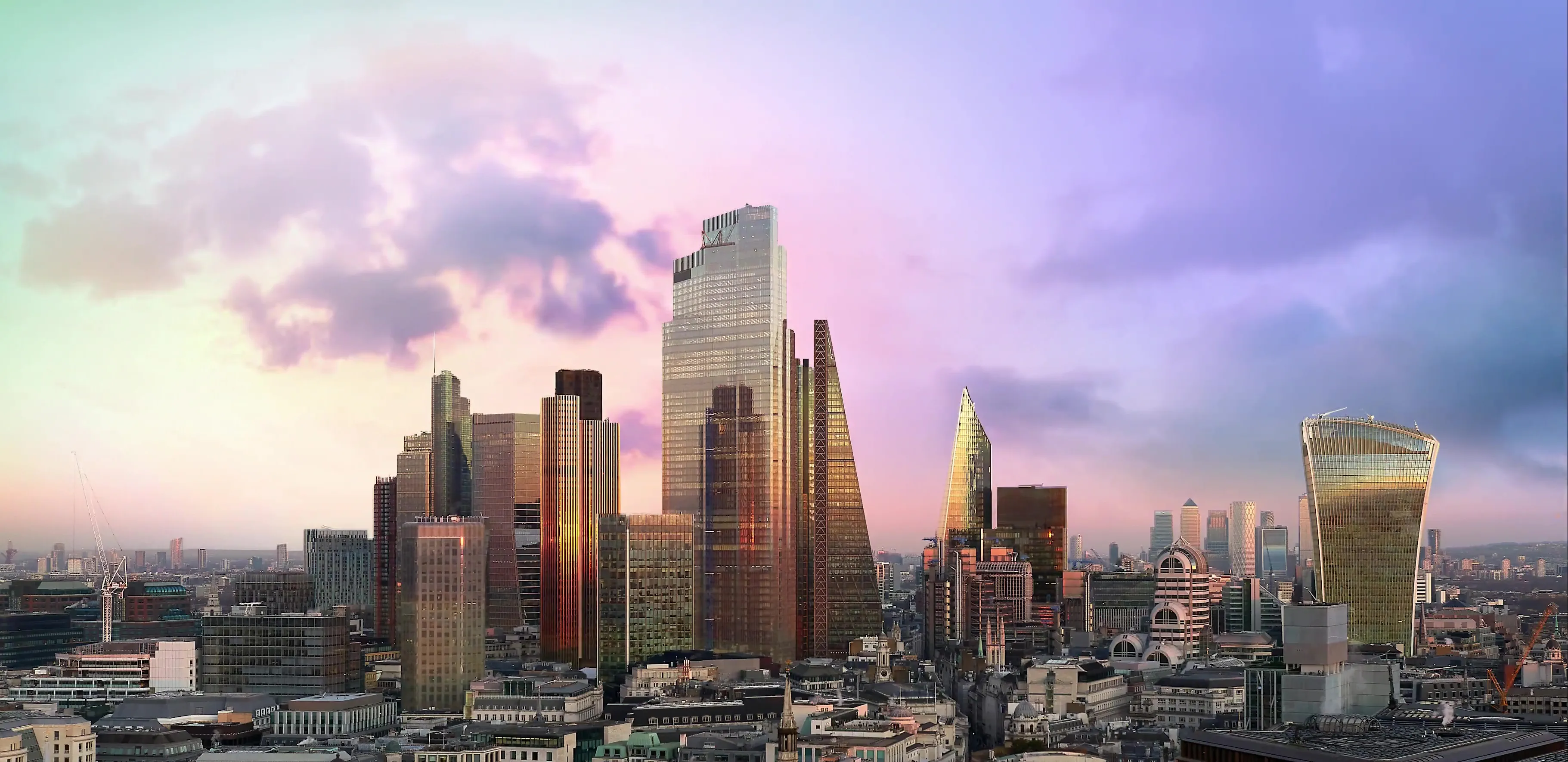 Sunset view of London’s financial district skyline featuring iconic skyscrapers including the Leadenhall Building and Walkie-Talkie Tower – representing the dynamic global landscape of mergers and acquisitions